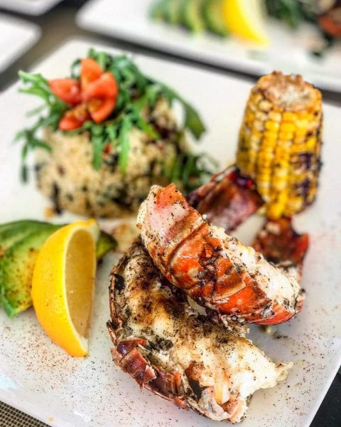 Health and Wellness meal, lobster, grilled corn on yacht charter Sea Boss