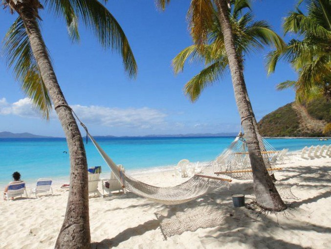 White sandy beach on St. Thomas, accessible while on sail with the USVI Sailboat August Maverick
 